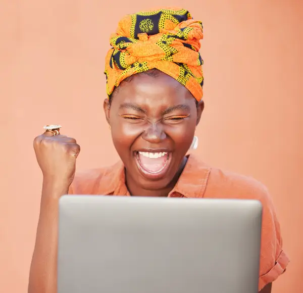 African woman merchant happy after a successful payment